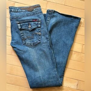 BCBG MaxAzria blue flare leg jeans with classic indigo hue